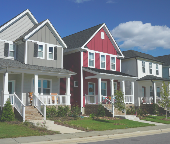 A row of houses with a red one in the middle