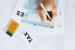 person looking at a 1040 tax document