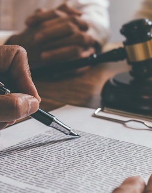 lawyer writing information on a piece of paper