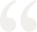 A pair of white quotation marks on a white