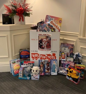 A box of toys for tots sits on a table