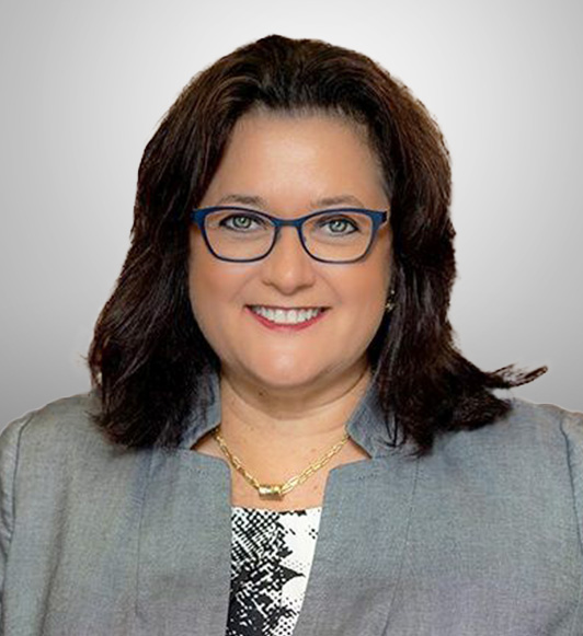 Shareholder Heather Royer smiling for the camera during her company headshot