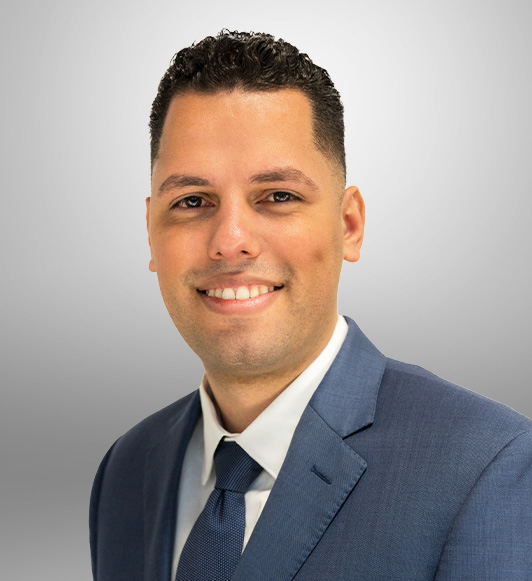 Attorney Starlin Colon in a blue suit jacket and tie