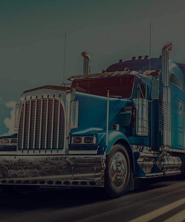 A blue semi truck with the number 24 on the front