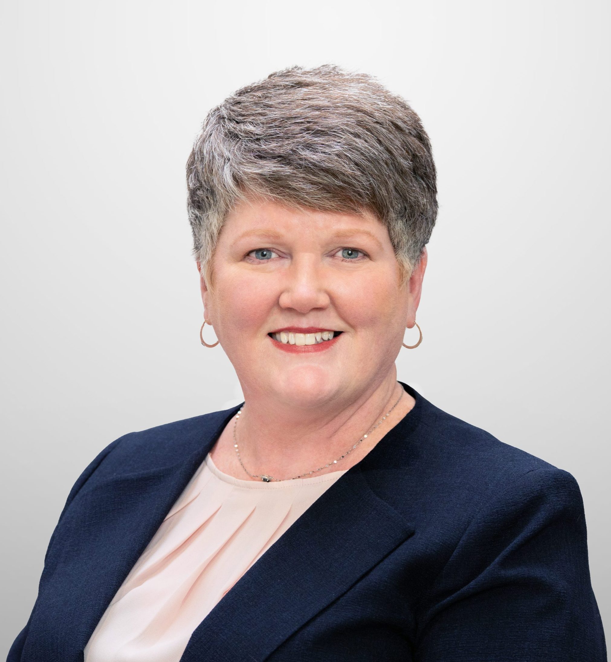 Associate Kristin E. Jaquis smiles for a company headshot